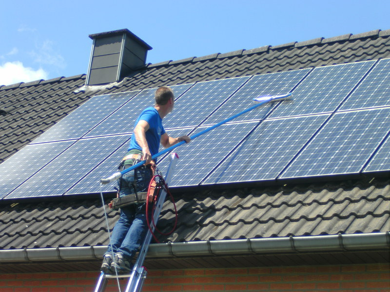 Bright Panels technician cleaning solar panels